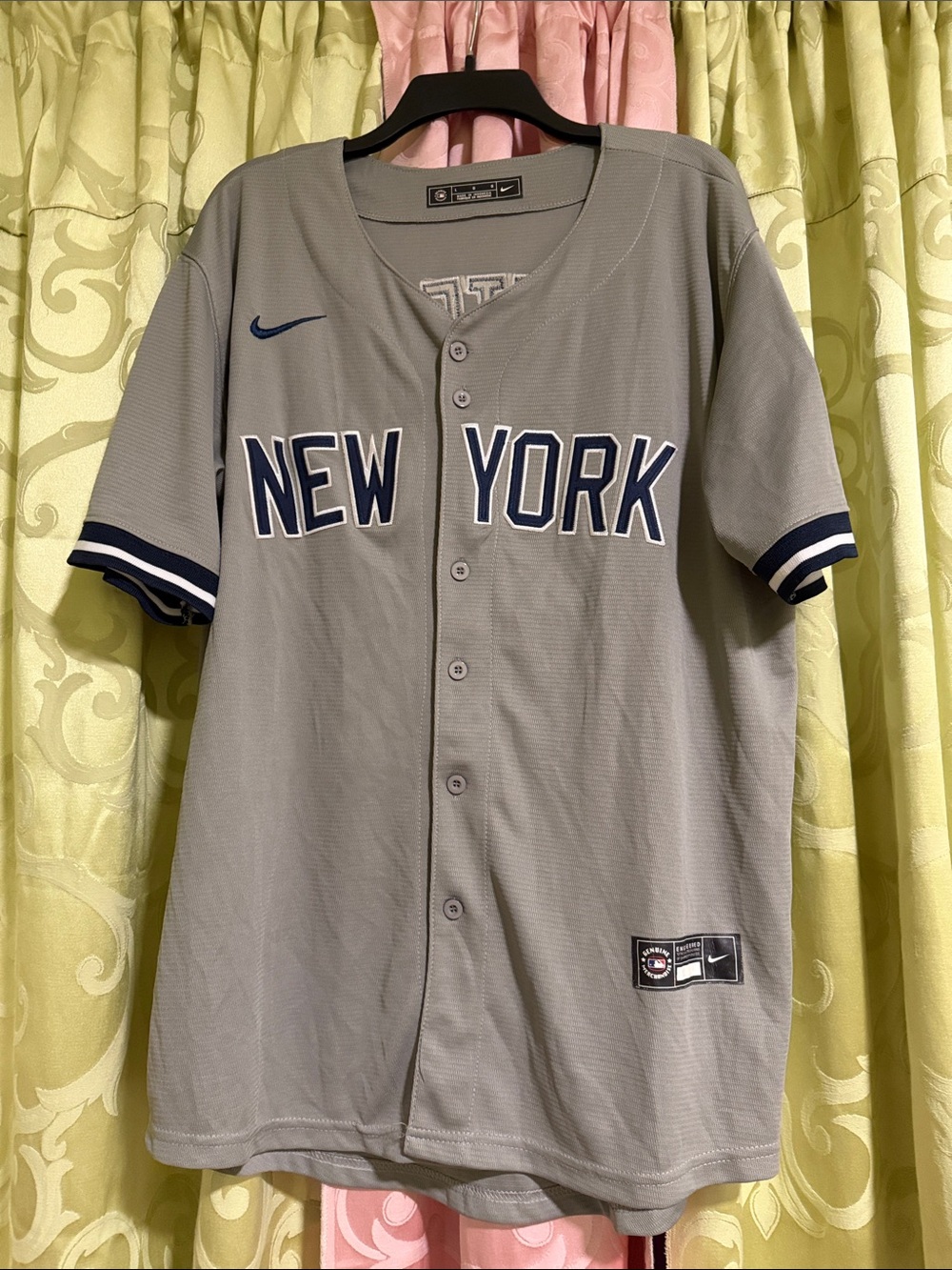 Nike Menโs Grey New York Baseball Jersey with Navy Trim